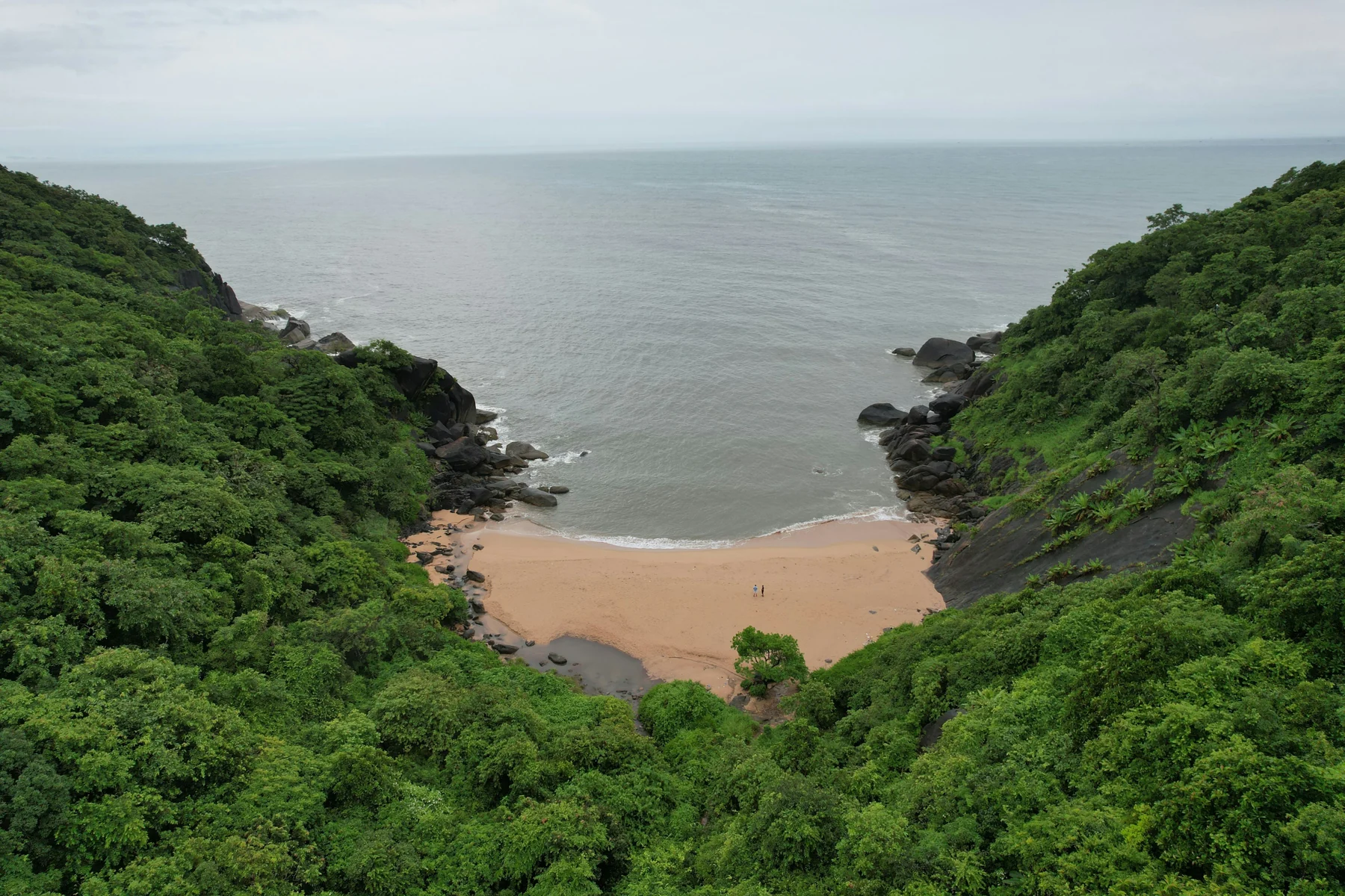A forest-framed cove at Butterfly Beach, South Goa